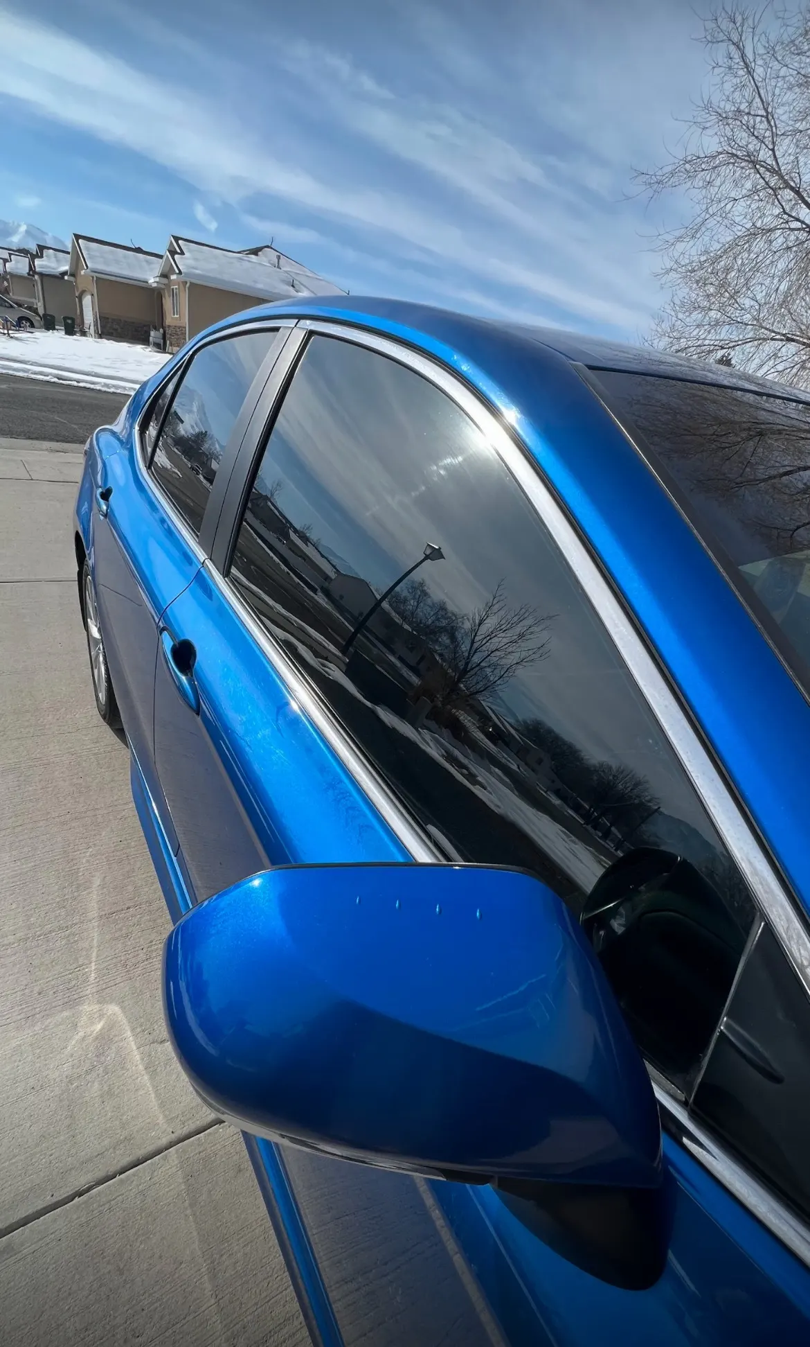 Close-up of a tinted car window showing the clean edge line