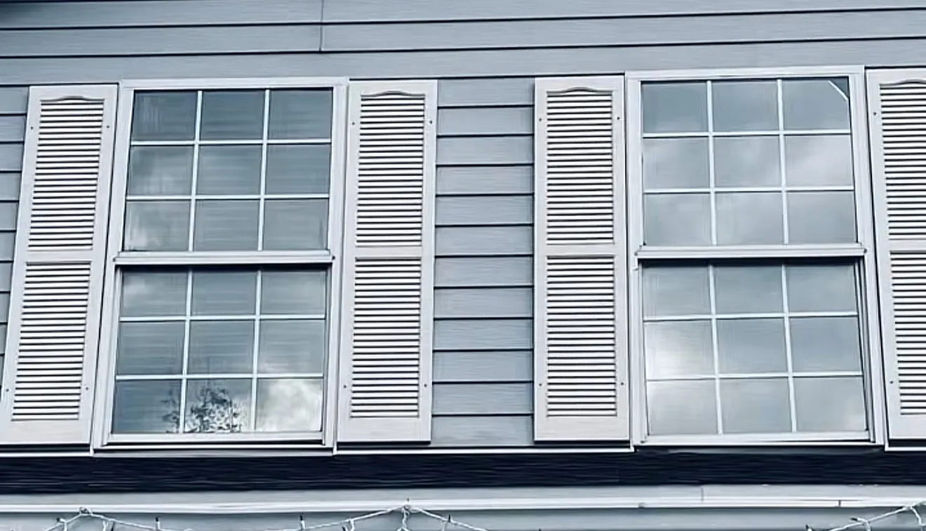 Home exterior with tinted double-hung windows